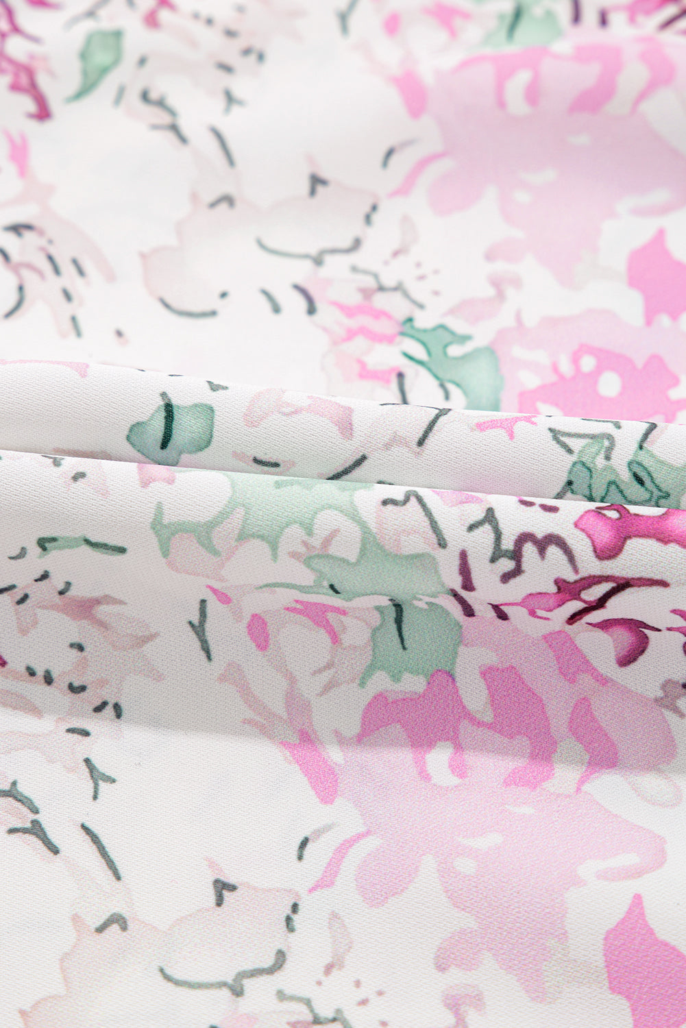 Chemisier babydoll rose à imprimé floral, manches ballon froncées, dos troué