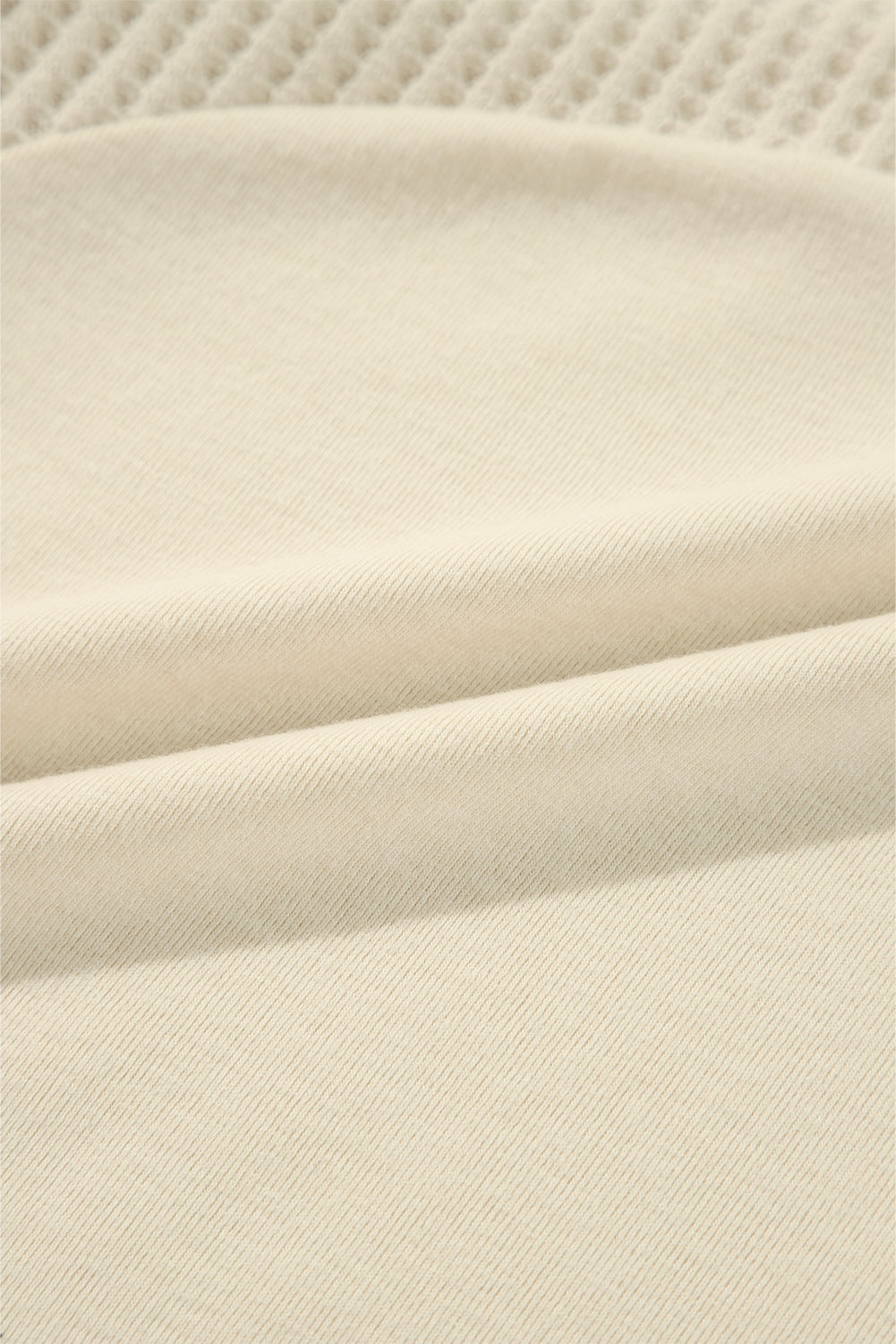 Haut beige à manches longues en tricot thermique avec coutures apparentes