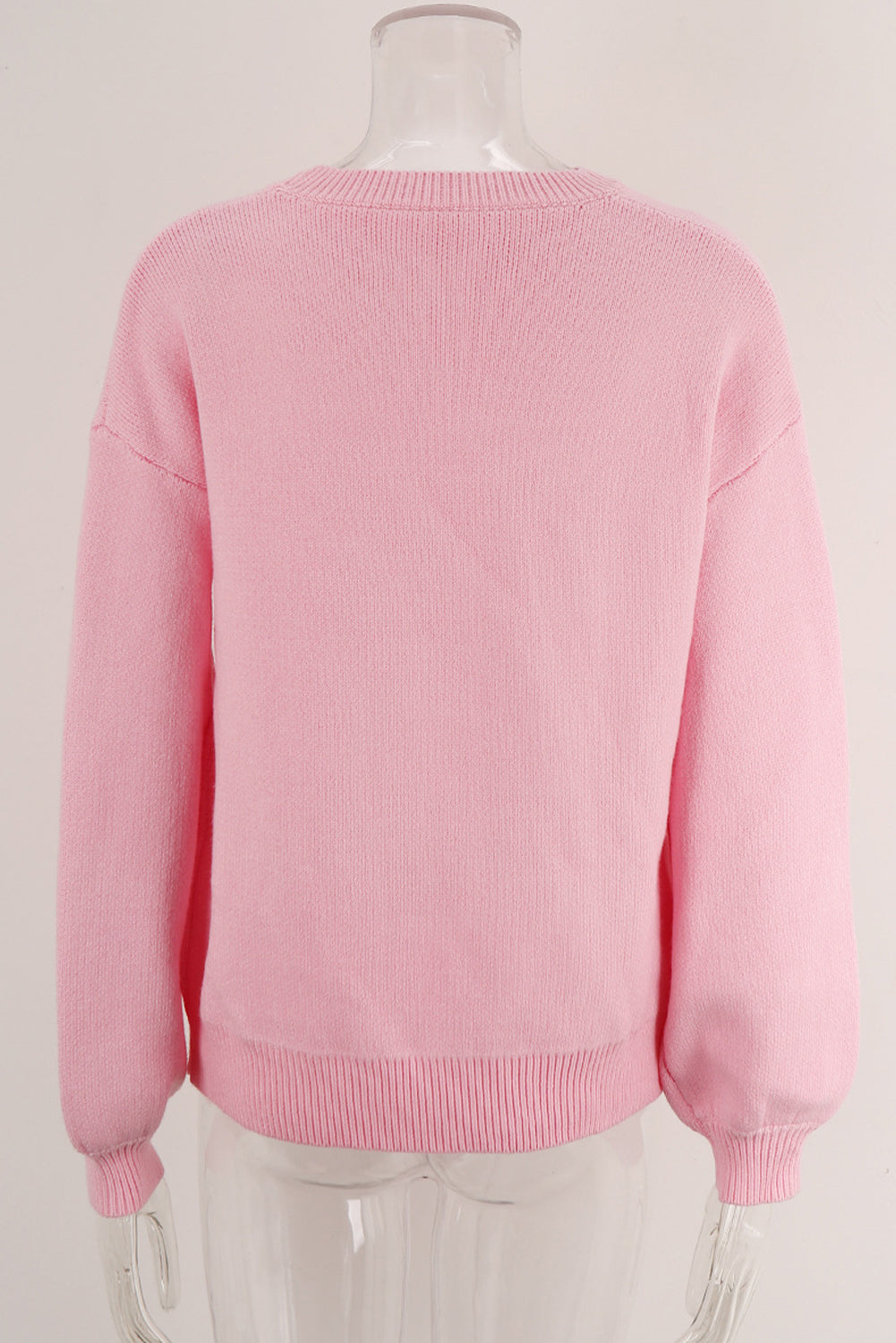 Pull col rond à épaules tombantes et nœud rose