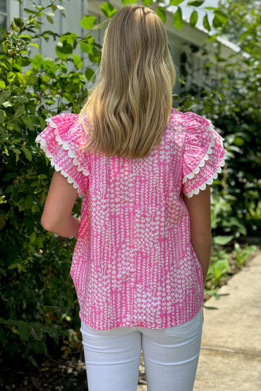Chemisier rose à imprimé abstrait et bordure Ric Rac, manches flottantes, col en V cranté