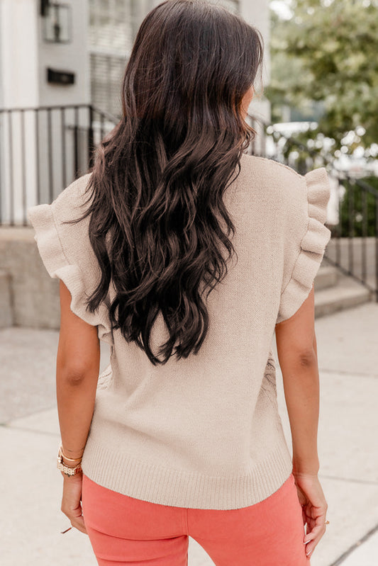 Pull à manches courtes et col montant en maille torsadée parcheminée