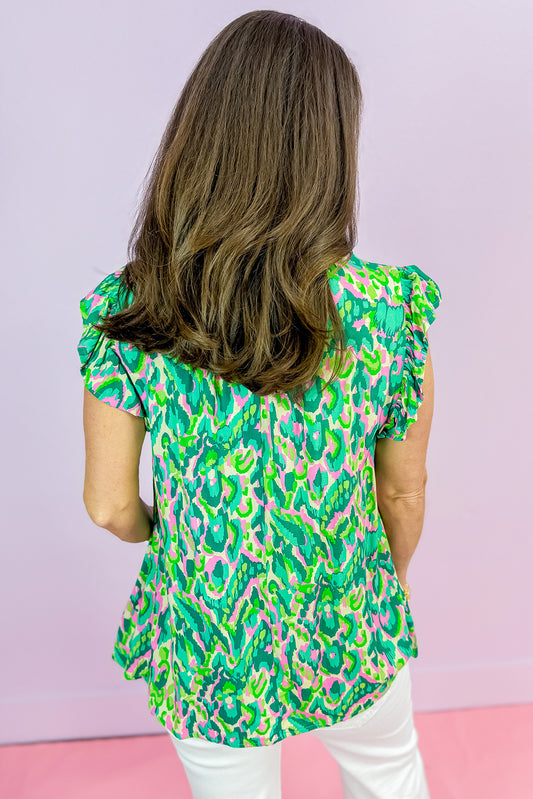 Débardeur vert à imprimé abstrait, bordure à volants et col fendu noué