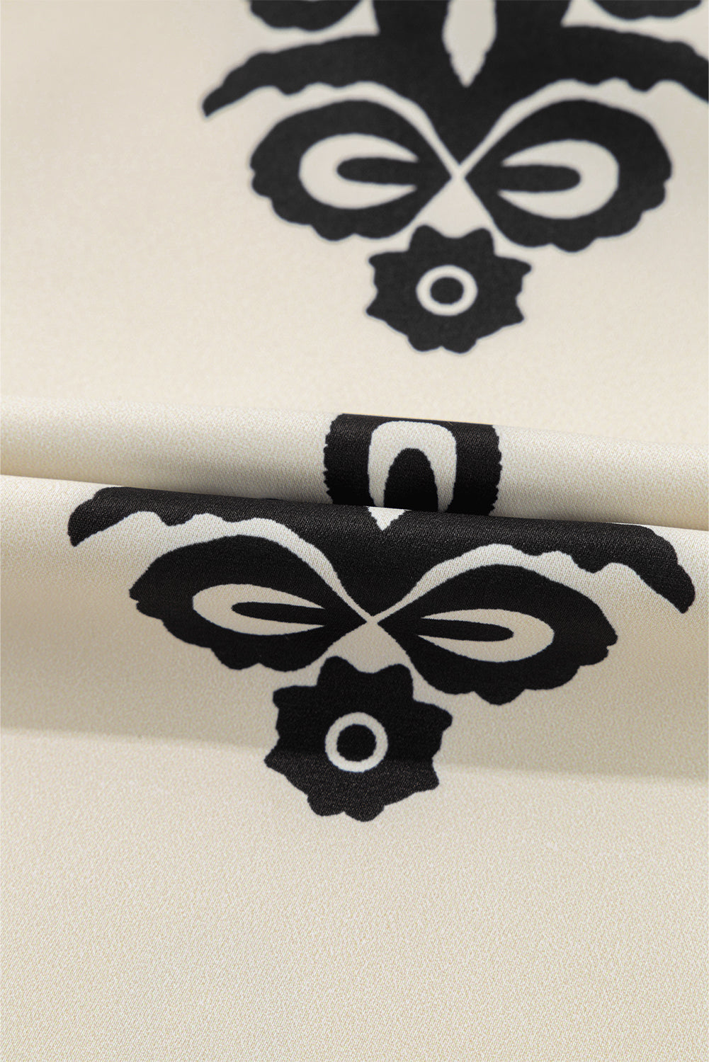 Mini-robe beige à imprimé géométrique sans manches avec nœud papillon dans le dos