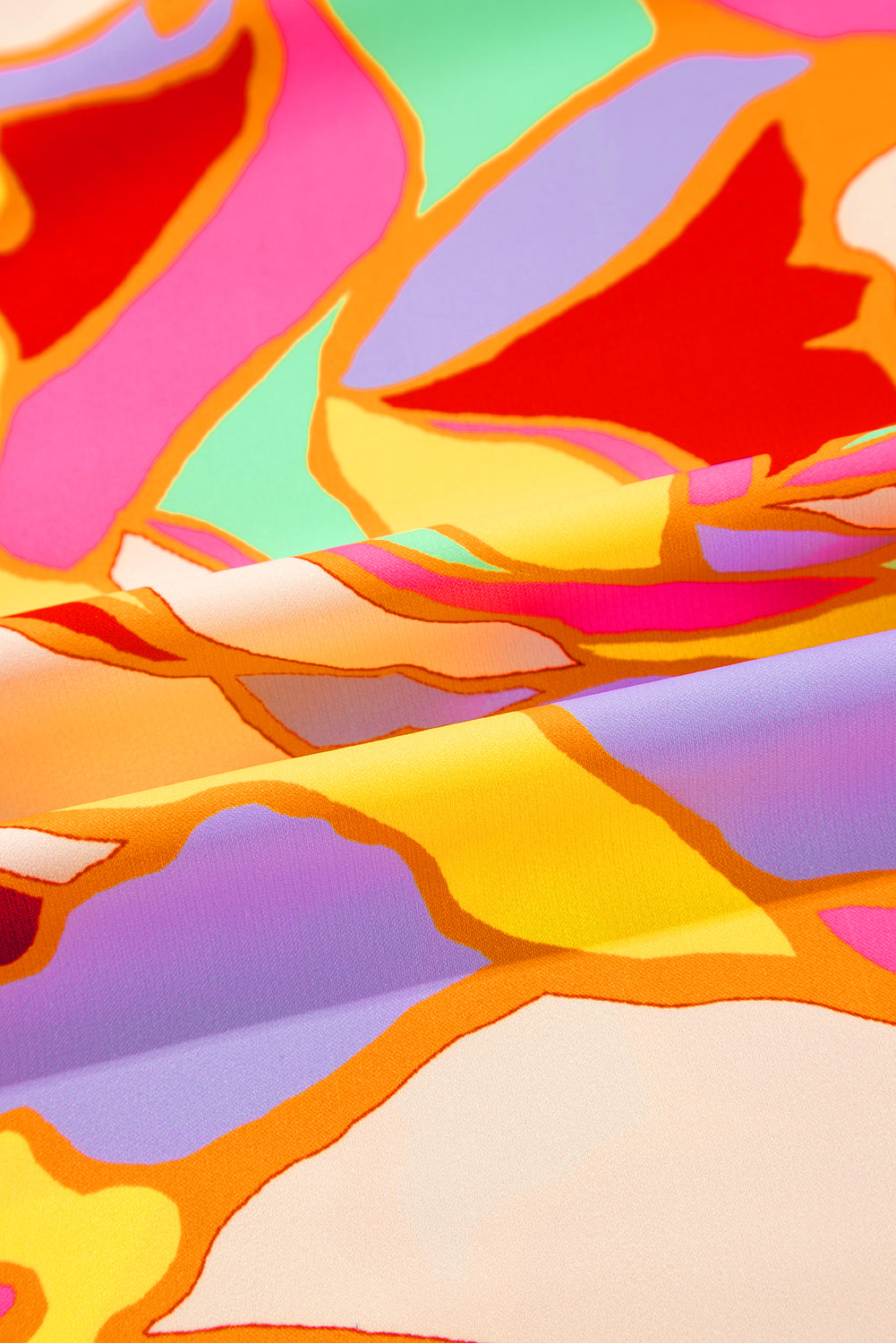 Chemisier jaune à manches bouffantes et imprimé abstrait