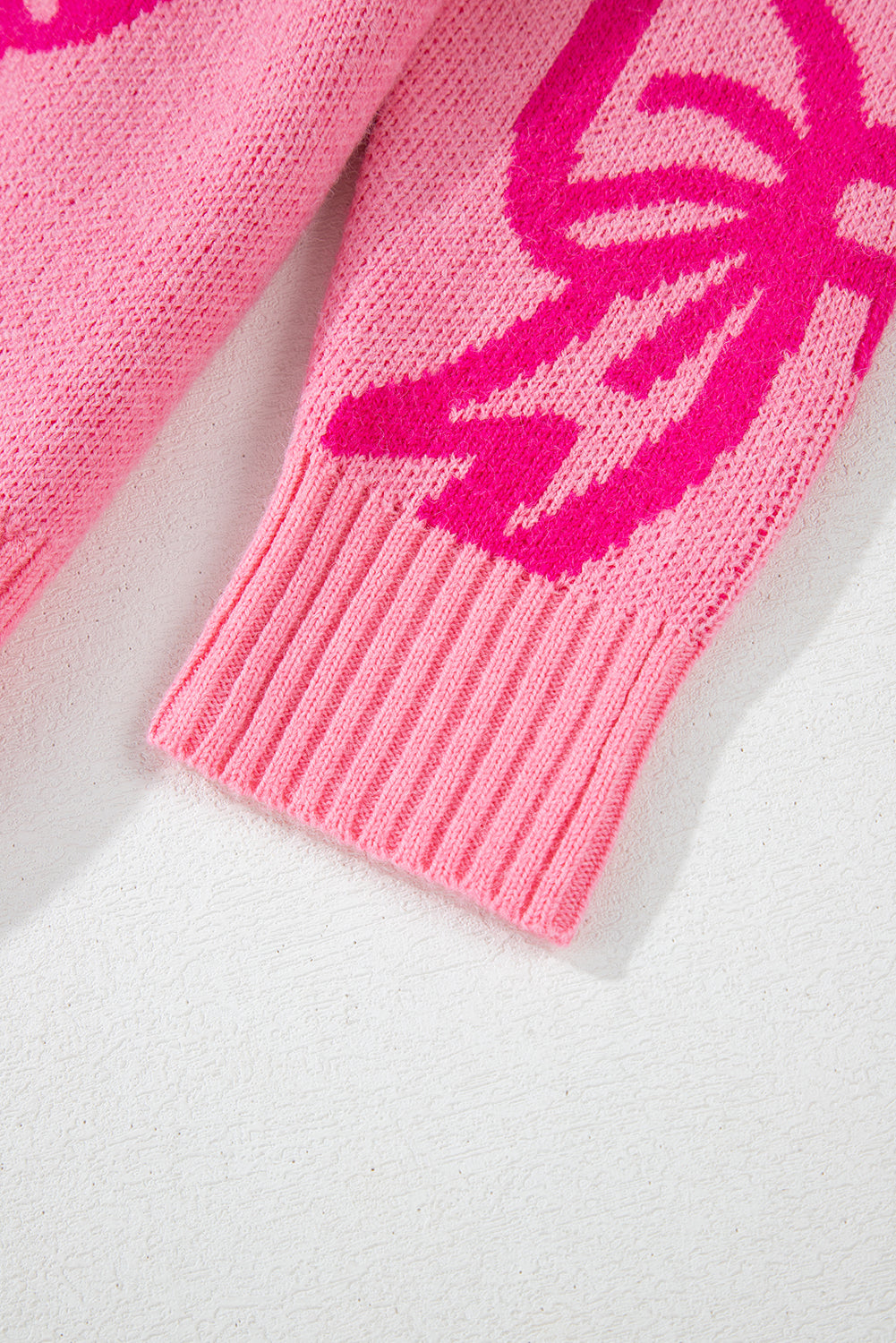 Pull ample à épaules tombantes et motif nœud rose