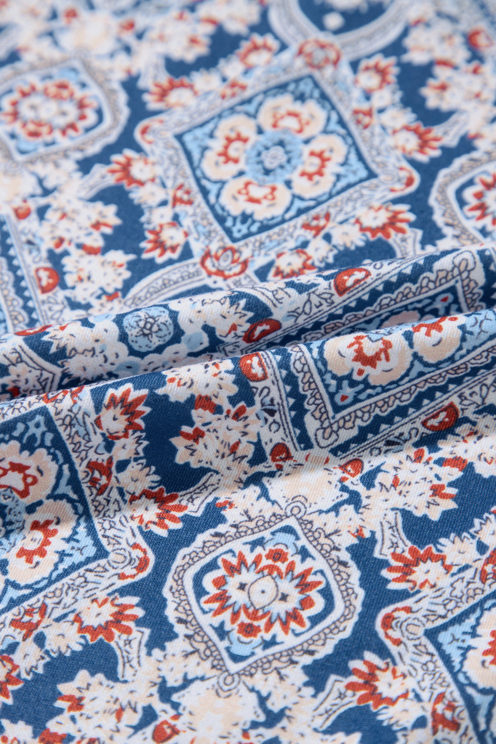 Haut à manches longues raglan bleu en dentelle à imprimé géométrique et patchwork