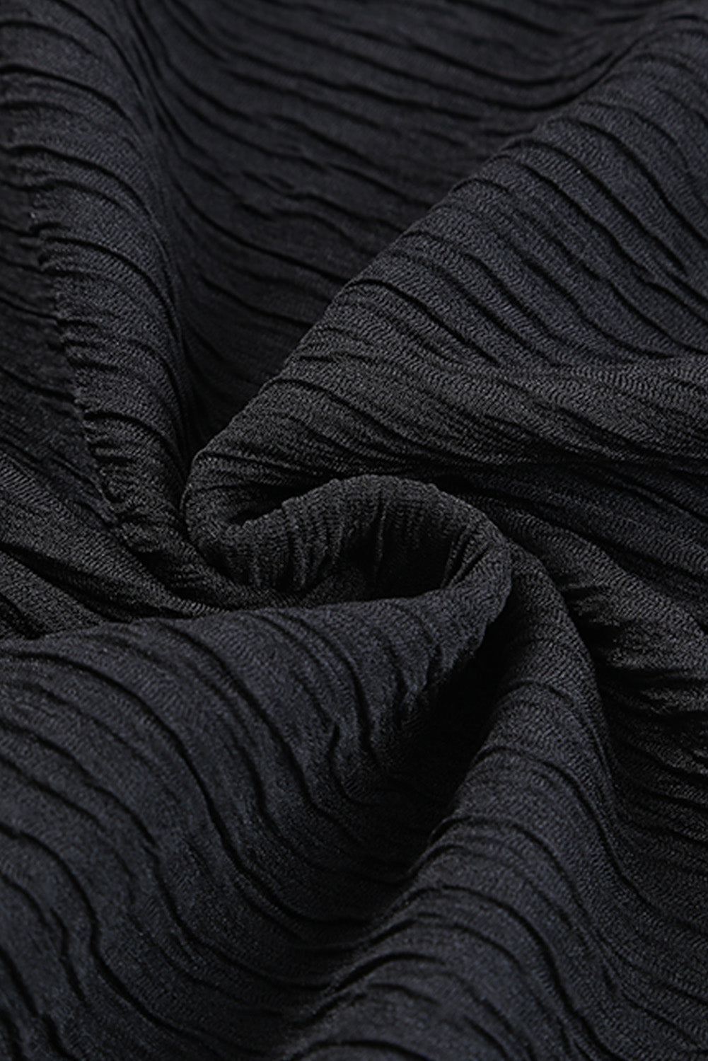 Chemisier texturé à manches évasées et col smocké à volants