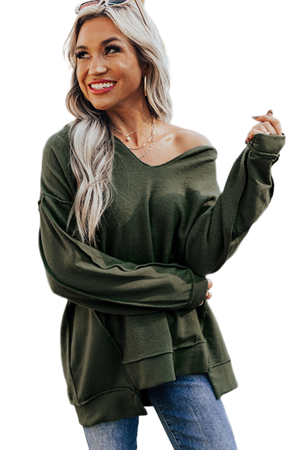 Haut vert à manches longues et col fendu avec coutures apparentes