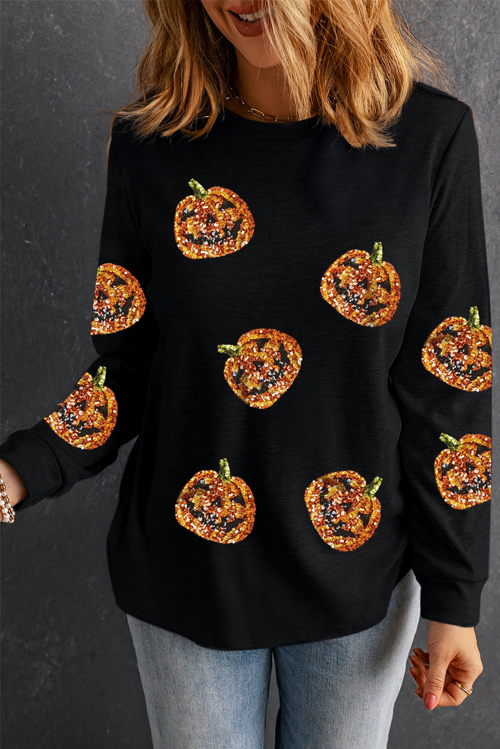 Pull à manches longues noir à paillettes et motif citrouille d'Halloween