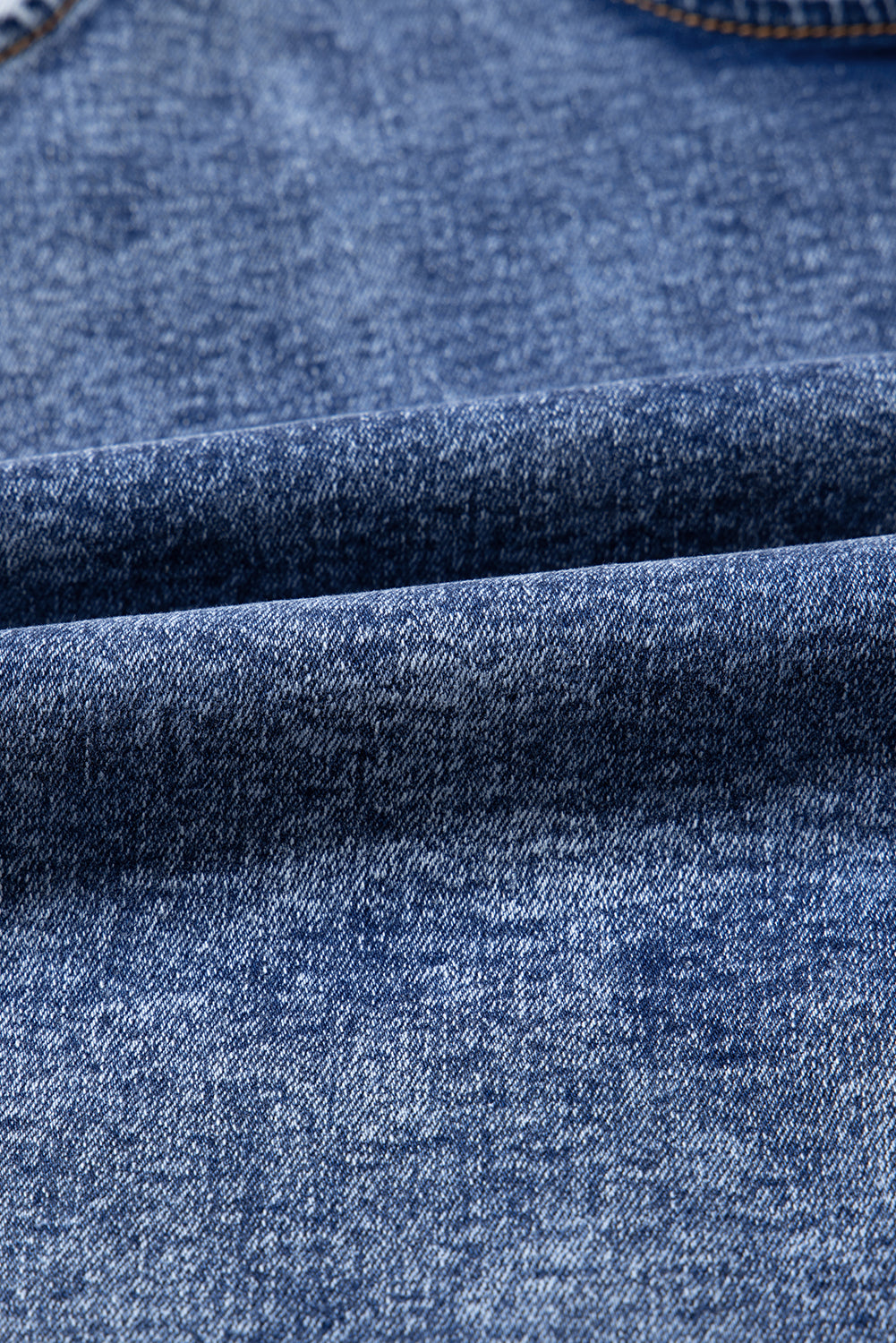 Combinaison en jean bleu crépuscule sans manches à col en U et poches plaquées