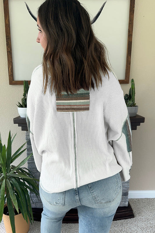 Haut en tricot gaufré à rayures blanches et coutures apparentes