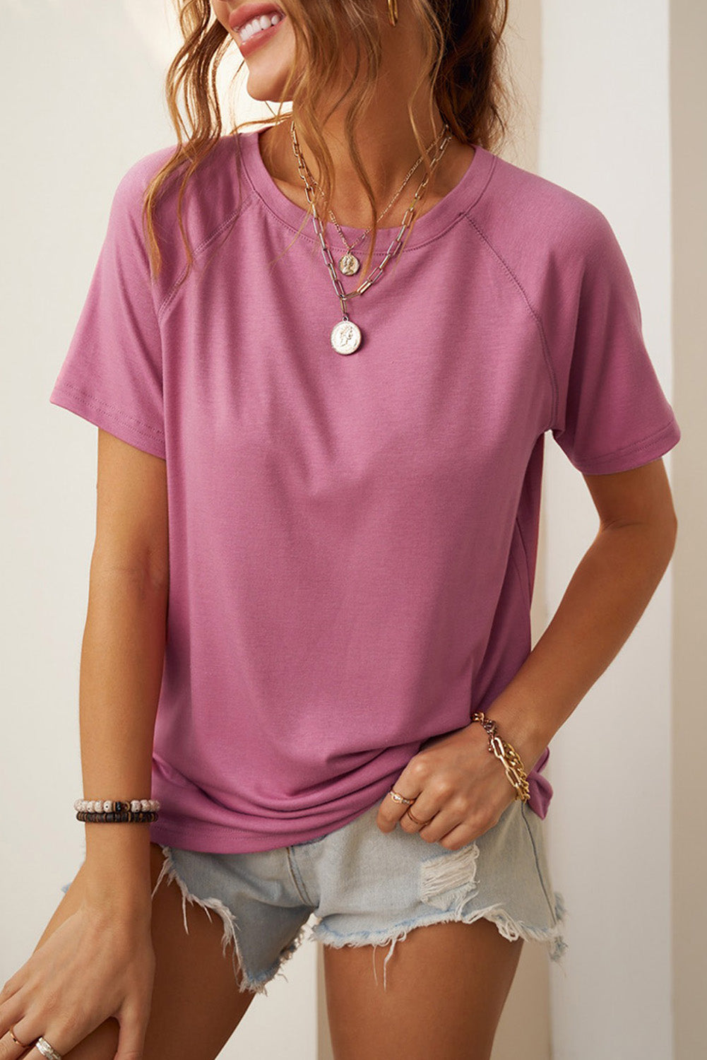 Camiseta con cuello redondo y manga raglán