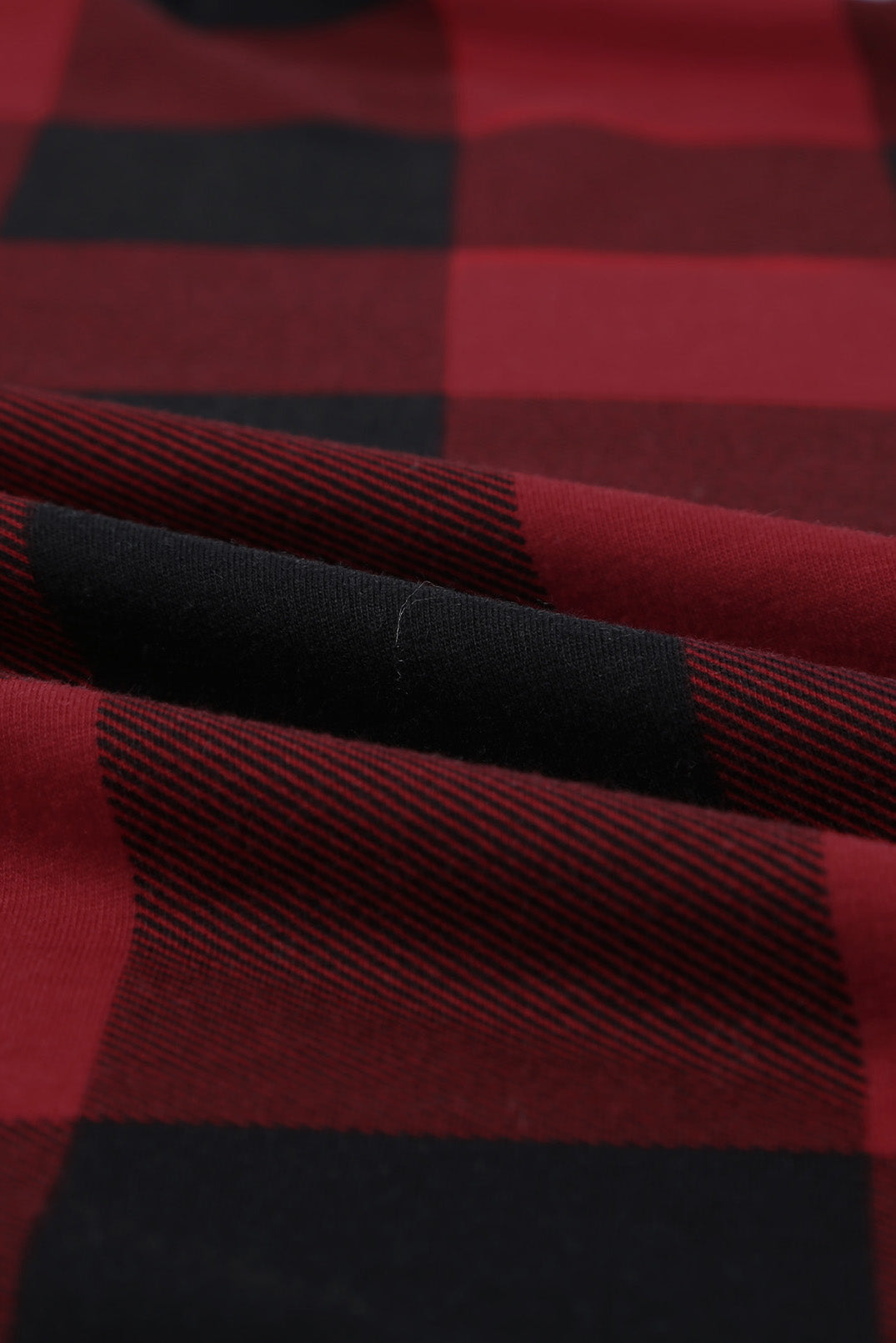 Haut à manches longues à carreaux avec coudières