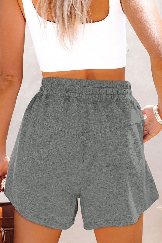 Pantalones cortos de punto con cordón elástico en la cintura y bolsillos laterales