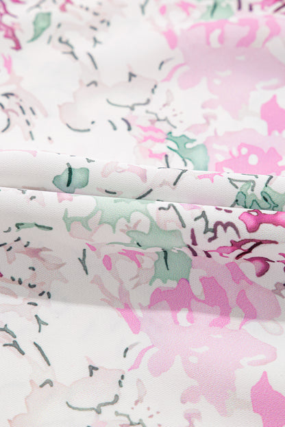 Chemisier babydoll rose à imprimé floral, manches ballon froncées, dos troué