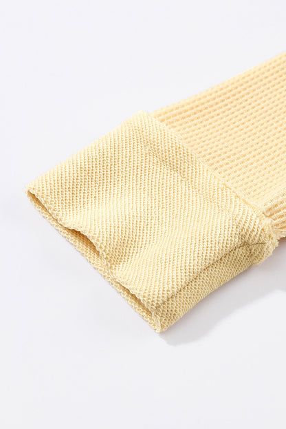 Top de manga larga con botones de punto tipo gofre marrón 