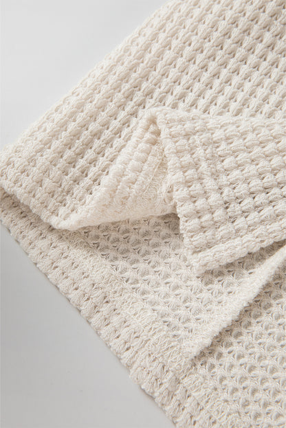 Haut oversize en tricot gaufré abricot à manches chauve-souris fendues