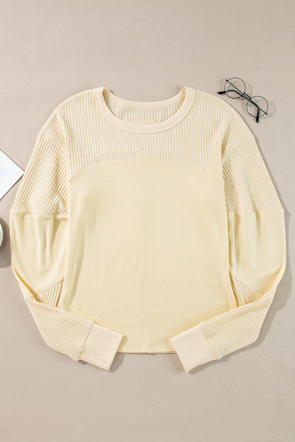 Haut beige à manches longues en tricot thermique avec coutures apparentes