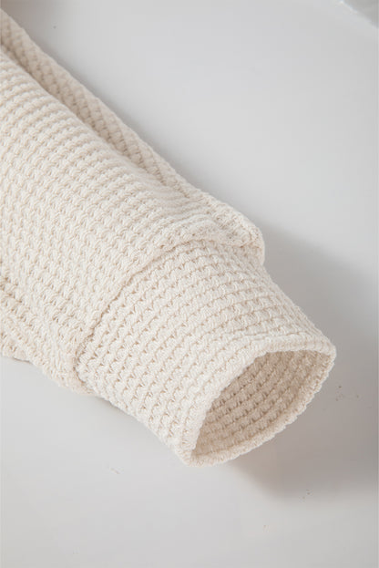 Haut oversize en tricot gaufré abricot à manches chauve-souris fendues