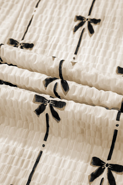 Haut à manches courtes bouffantes et imprimé nœud beige