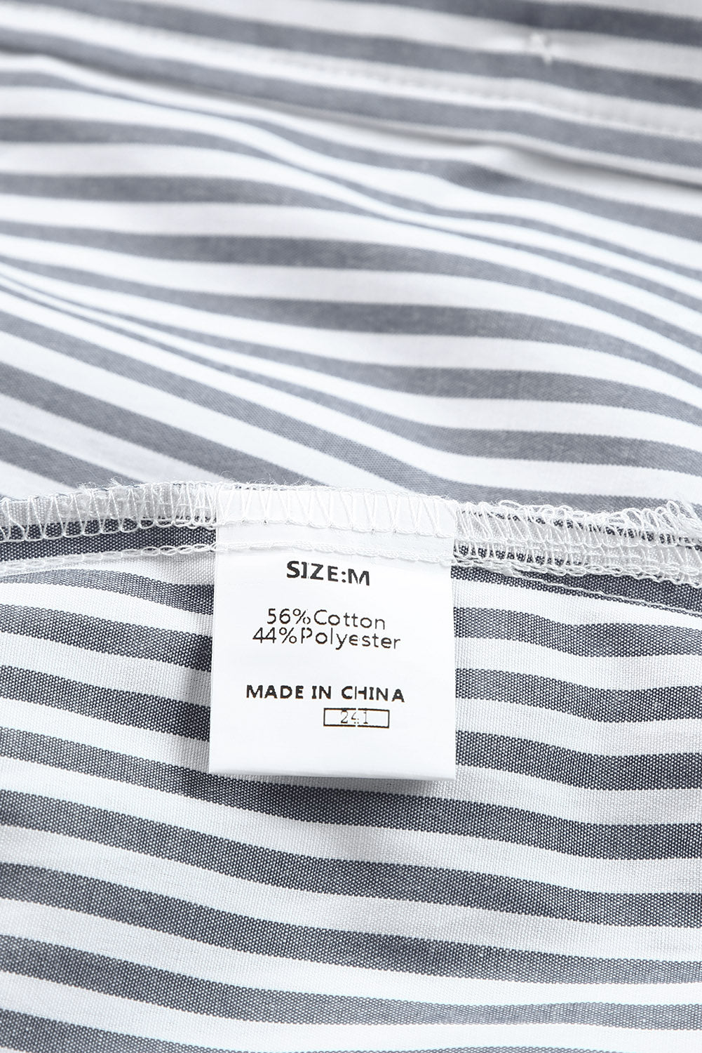 Camisa de manga larga con botones y bolsillos a rayas