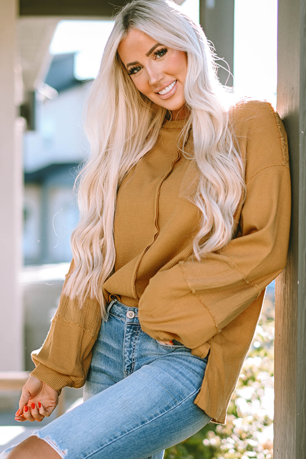 Haut en tricot gaufré à manches bouffantes et coutures apparentes