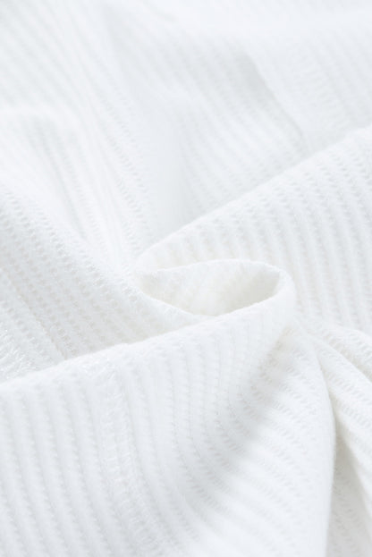 Top henley de punto gofre con medio botón 