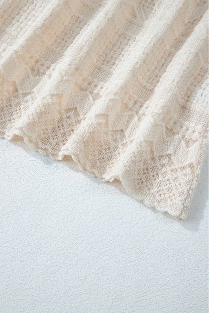 Chemisier blanc à manches longues et boutons en dentelle géométrique