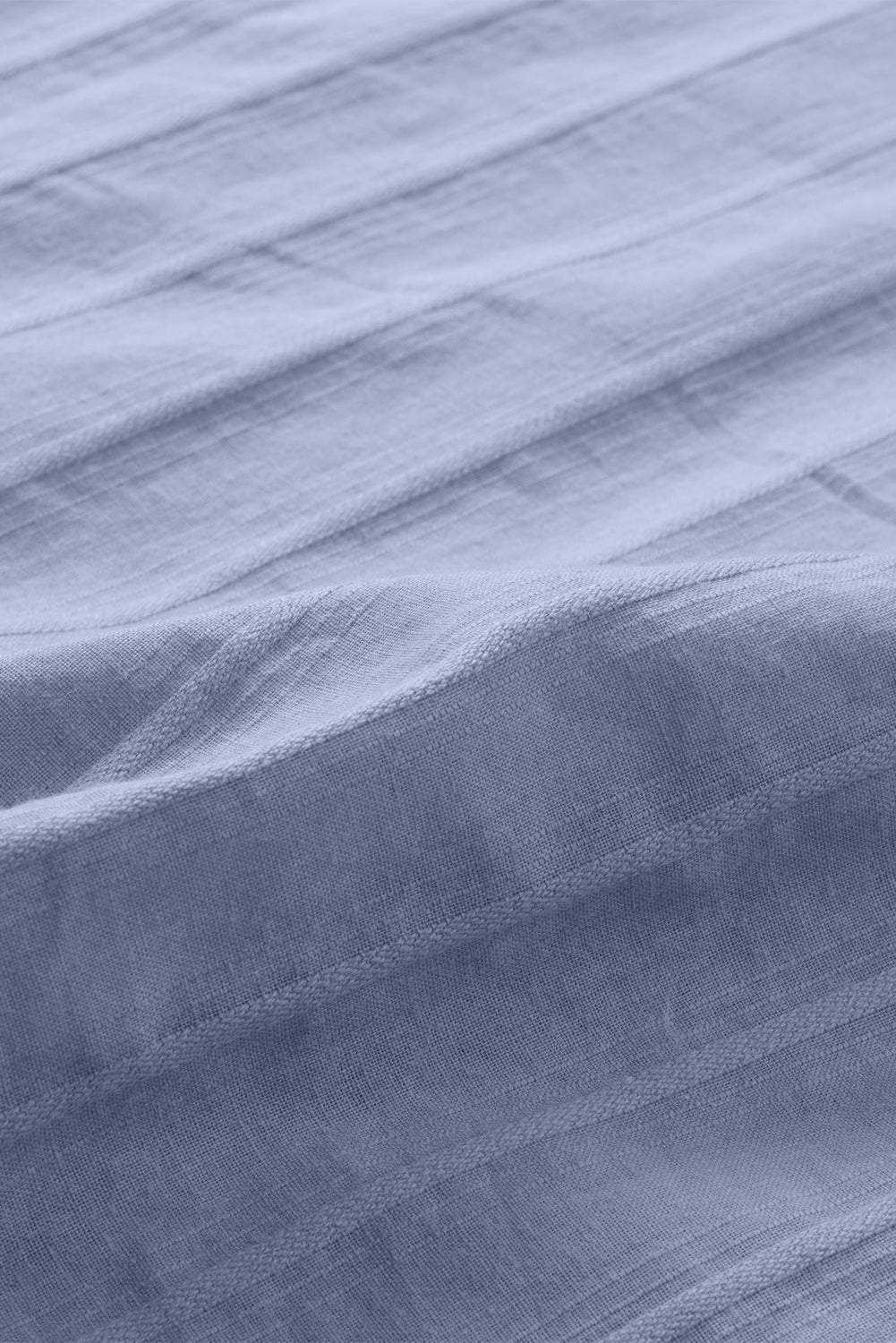 Camisa con botones texturizados y bolsillos