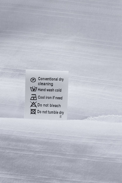 Camisa con botones texturizados y bolsillos