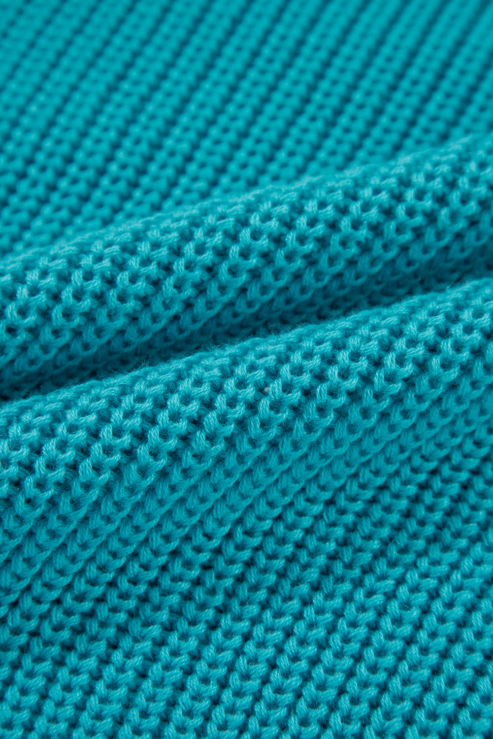Pull turquoise à volants et manches bouffantes