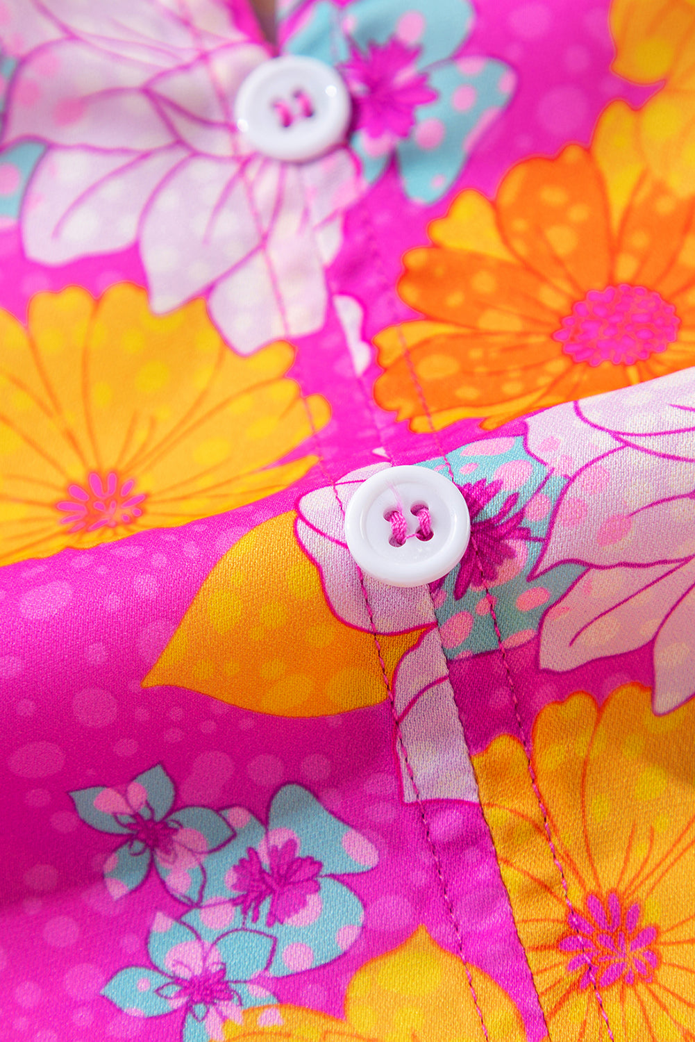 Chemisier à imprimé floral rose, manches volantées et col cranté