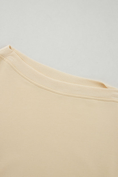 Sweat-shirt beige à manches boutonnées et épaules tombantes
