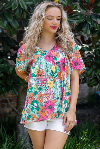 Top de manga corta con dobladillo asimétrico y estampado floral multicolor 