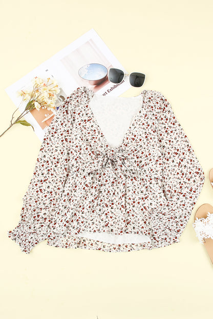 Blusa de manga larga con volantes y lazo delantero con estampado floral