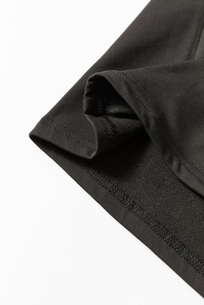 Haut thermique noir uni à col rond et coupe slim