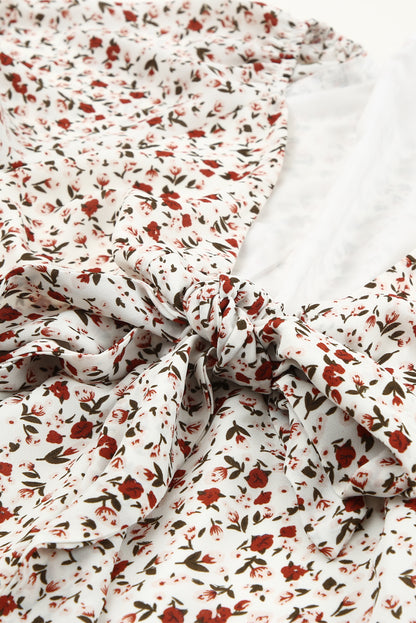 Blusa de manga larga con volantes y lazo delantero con estampado floral