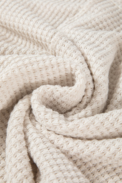 Haut oversize en tricot gaufré abricot à manches chauve-souris fendues