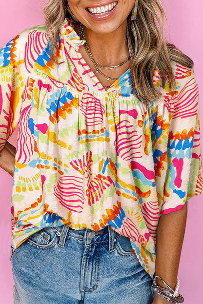 Chemisier orange à manches courtes et col en V, imprimé abstrait