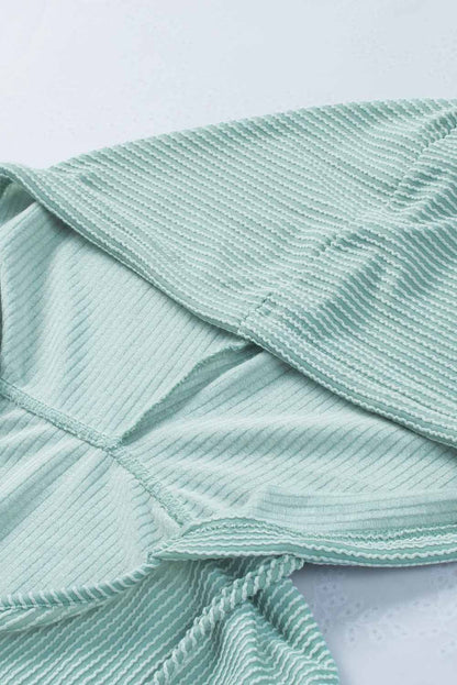 Sudadera con capucha holgada y cuello en V de canalé