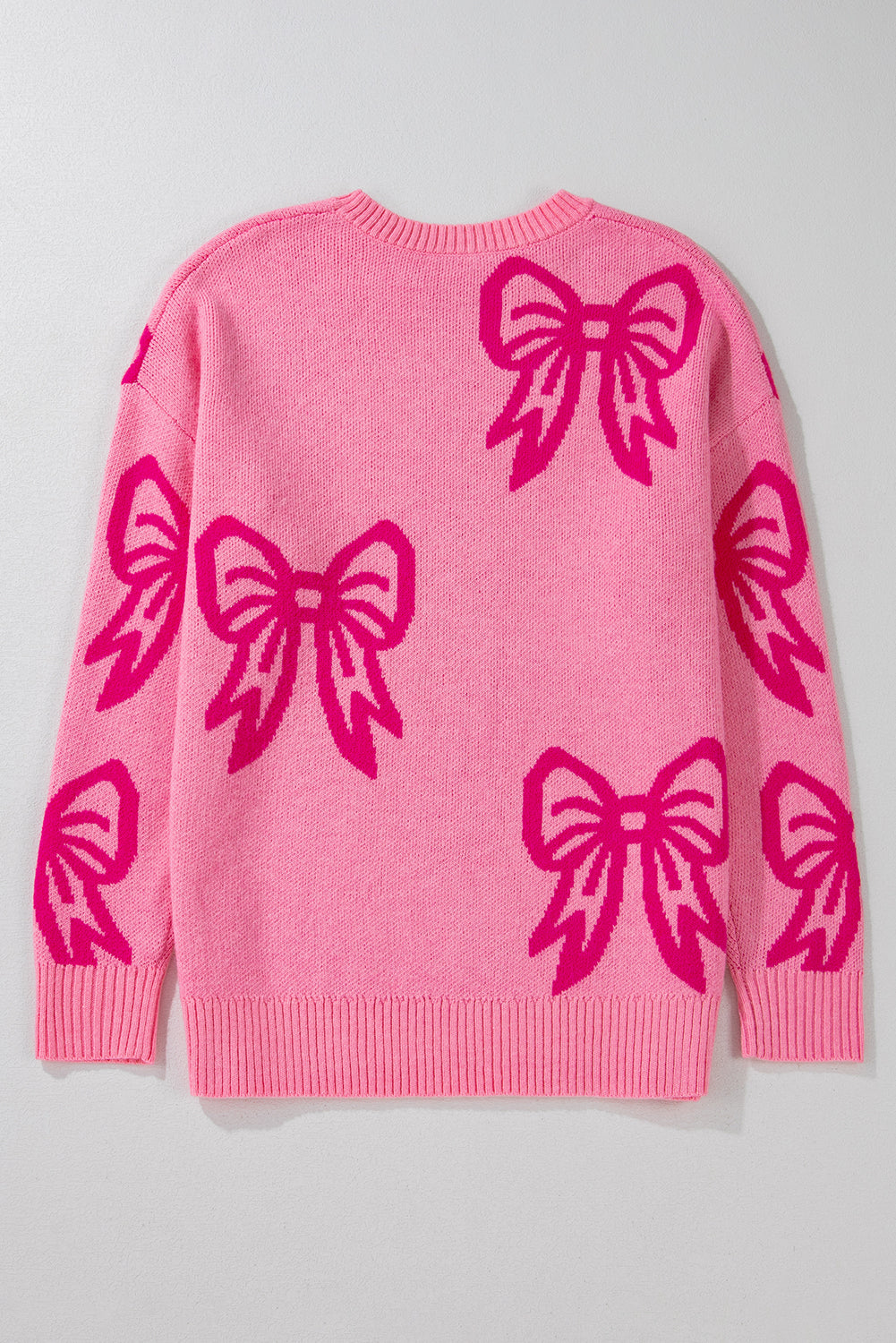 Pull ample à épaules tombantes et motif nœud rose