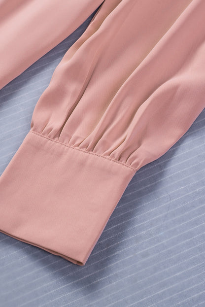 Chemisier boutonné à manches bouffantes de couleur unie