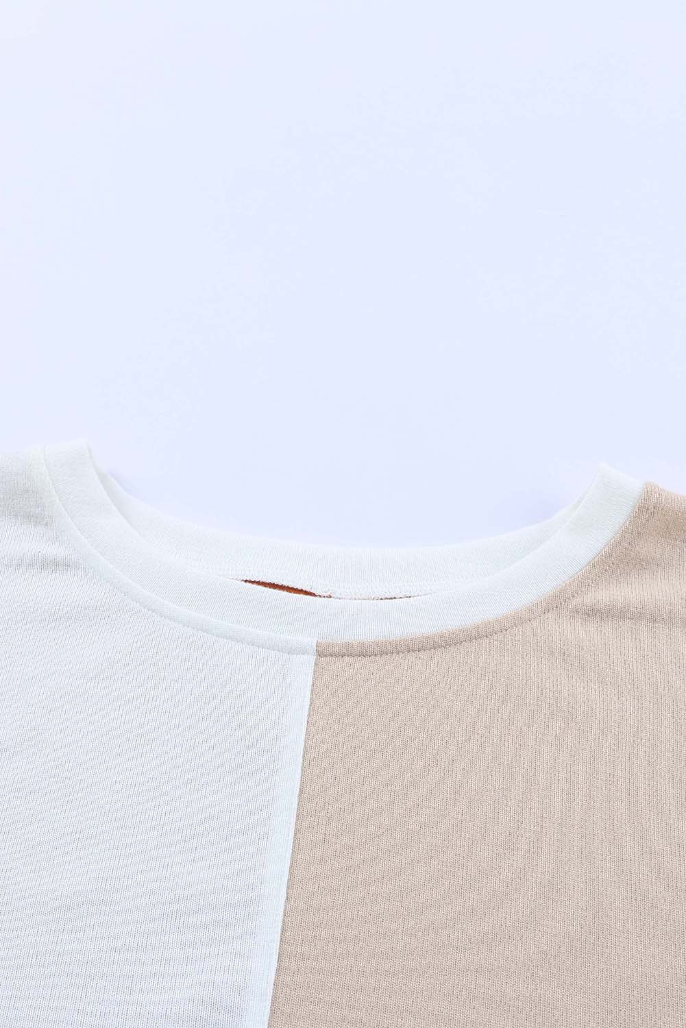 Top de manga larga con patchwork de bloques de color y bolsillos