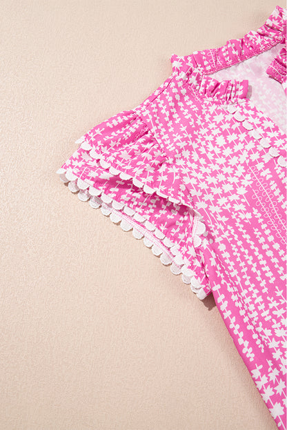 Chemisier rose à imprimé abstrait et bordure Ric Rac, manches flottantes, col en V cranté