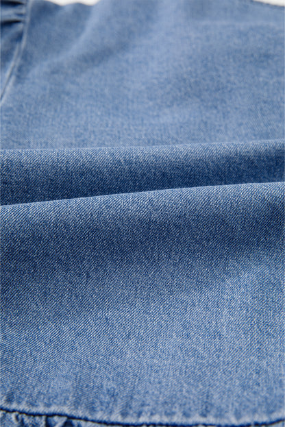 Chemise en jean péplum bleu crépuscule à manches bouffantes et nouée sur le devant