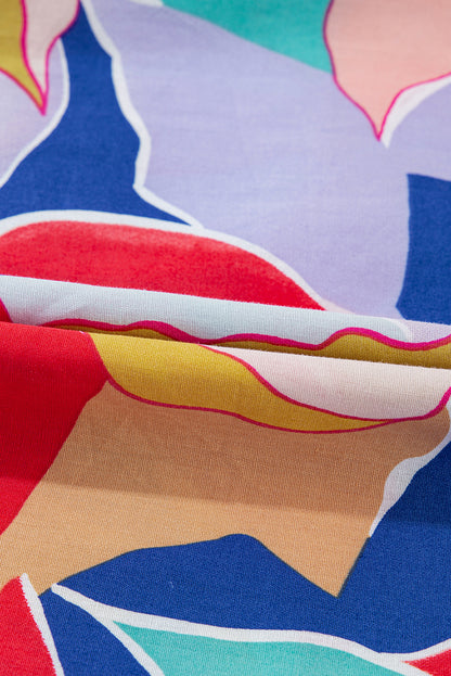 Chemisier rose à imprimé abstrait, manches volantées, col en V fendu et noué