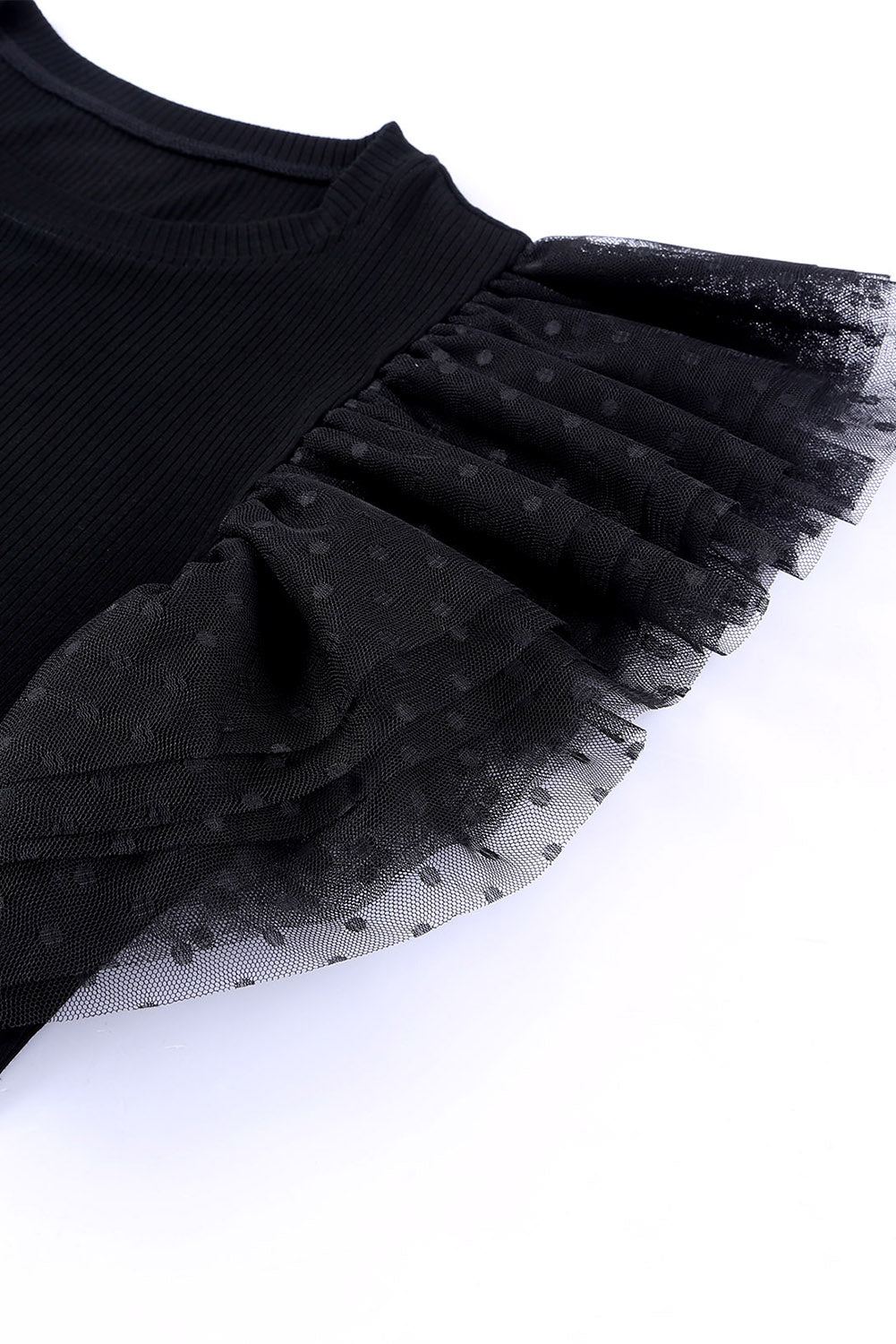 Haut en maille côtelée à volants et manches en maille à pois