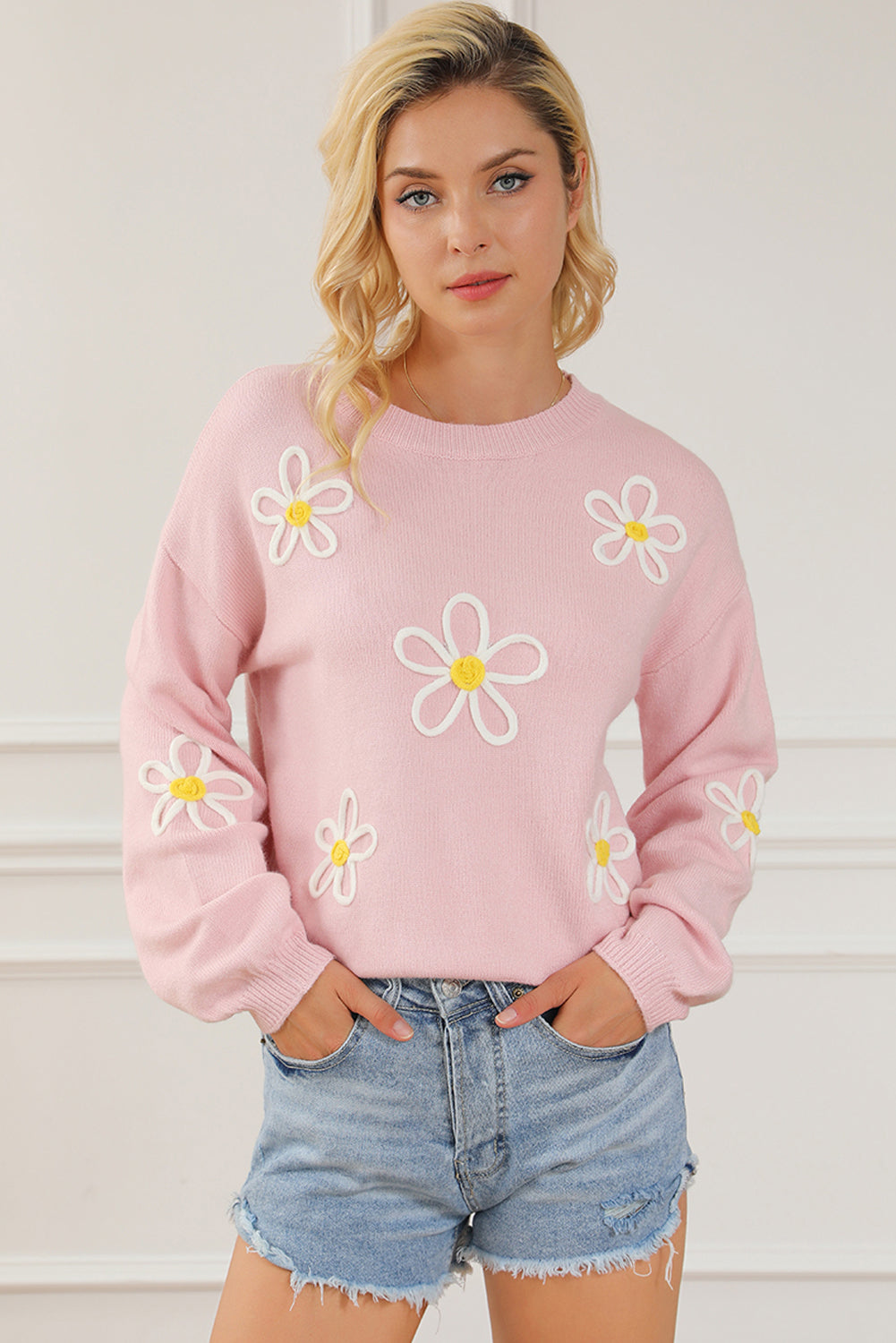 Pull ras du cou rose en chenille avec coutures marguerites 