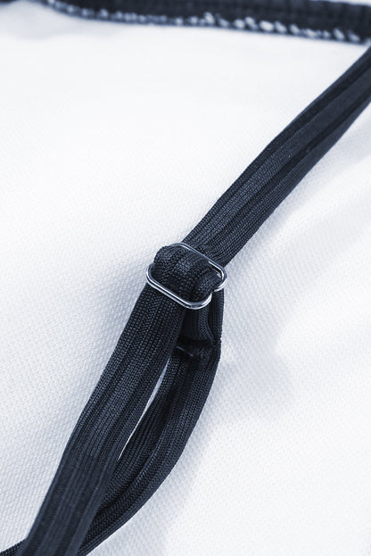 Maillot de bain une pièce bleu marine côtelé avec cordon de serrage et découpes sur les côtés