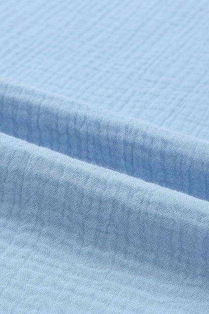 Chemisier texturé à manches flottantes et col à volants 